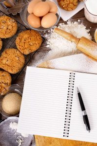 Chocolate chip cookies with ingredients and notebook