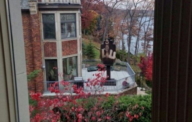Man Purchases House Next to Ex Wife’s Home – Erects Giant Middle Finger on Yard