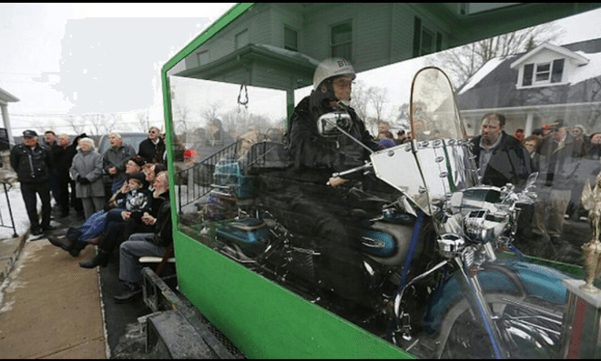 Dead Biker Buried In Transparent Coffin Sitting On His Harley
