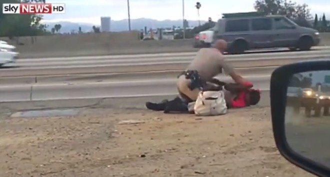 cop punching woman