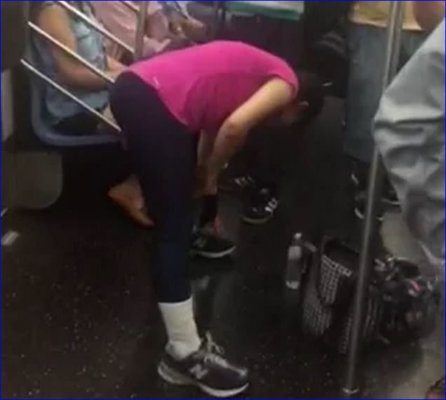 Woman Does Her Stretching Exercises On Crowded Train – Video