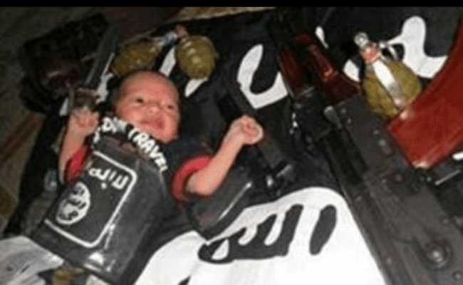 ISIS Posted Picture of Baby, Surrounded By Guns and Grenades – The NRA’s Wet Dream