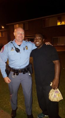 This Photo of Cop Hugging Suspect Who Tried to Stab Him Has Gone VIRAL