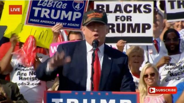 White Woman Holds “Blacks For Trump” Poster at Trump Rally – PIC