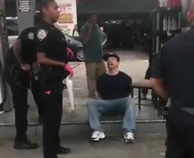 White Racist Berates Black Cop – Video